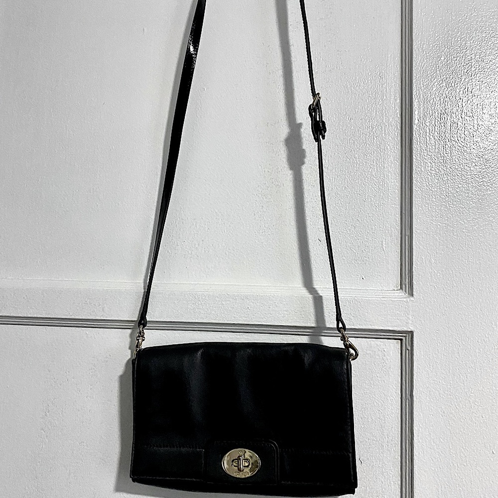 Kate Spade Black Sling Leather bag/Crossbody bag. The strap is adjustable.